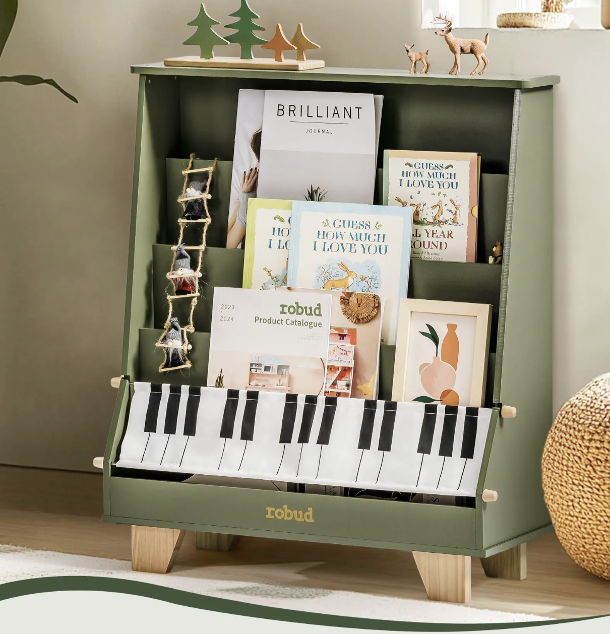 Sage green bookshelf with piano-key fabric hem, filled with picture books